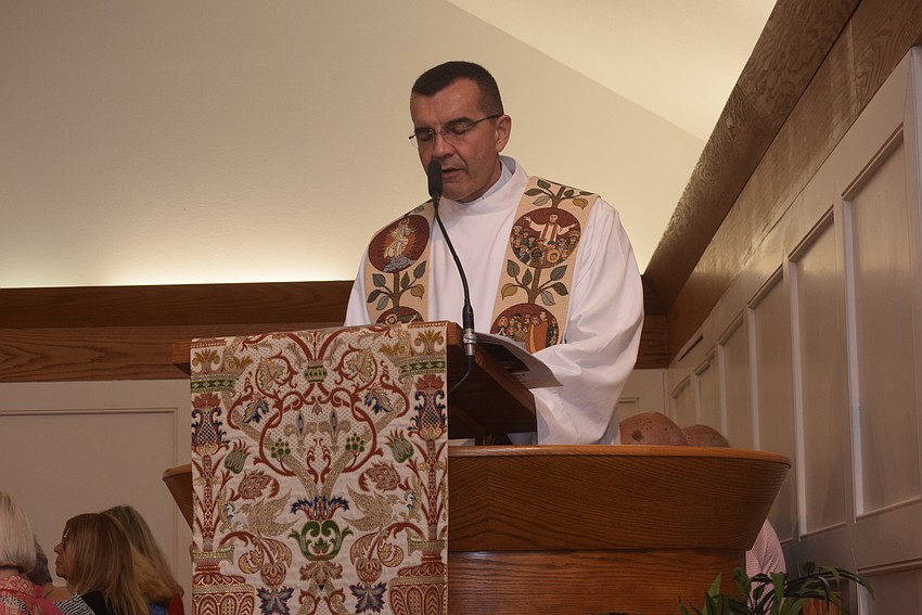 The Rev. Robert Dziedziak read the prayer of dedication for the donations collected at the service for All Faiths Food Bank.