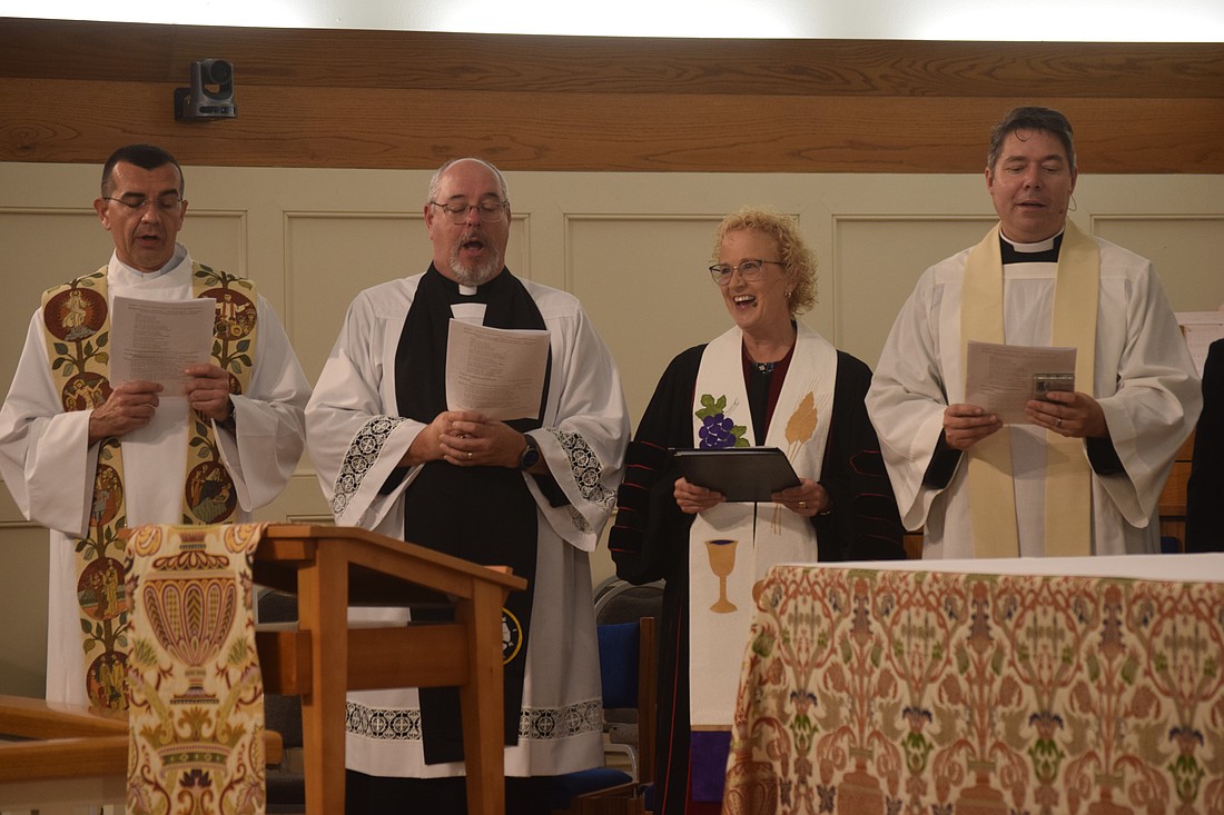 The Rev. Robert Dziedziak, Rev. Kenneth Blyth, Rev. Julia Piermont and Rev. David Marshall sang at the Interfaith service.
