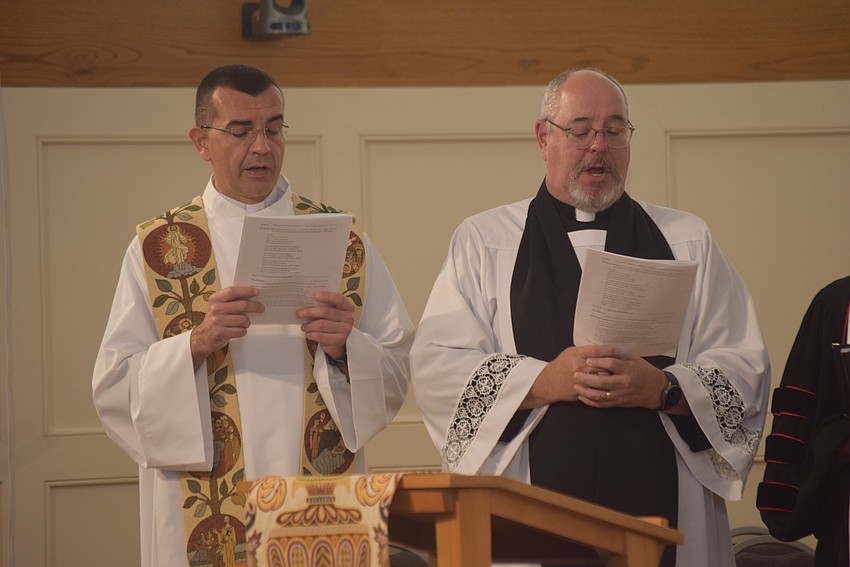 The Rev. Robert Dziedziak and  Rev. Kenneth Blyth sang at the Interfaith service.