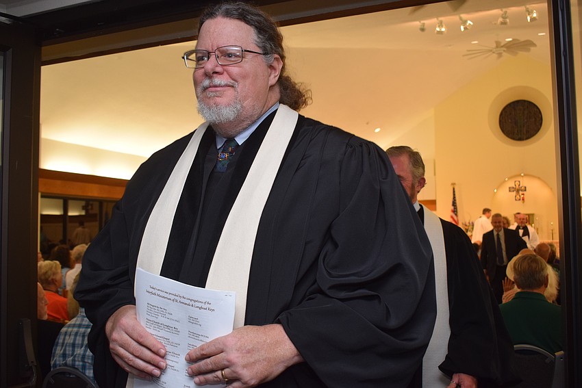 The Rev. Jeffrey Nunes exited the service followed by his religious peers.