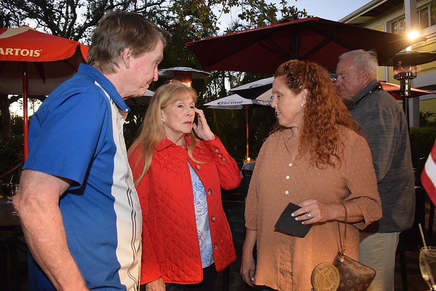 Earl Larson, Lynn Larson and Tryla Larson chatted at the Kiwanis Club first evening social.