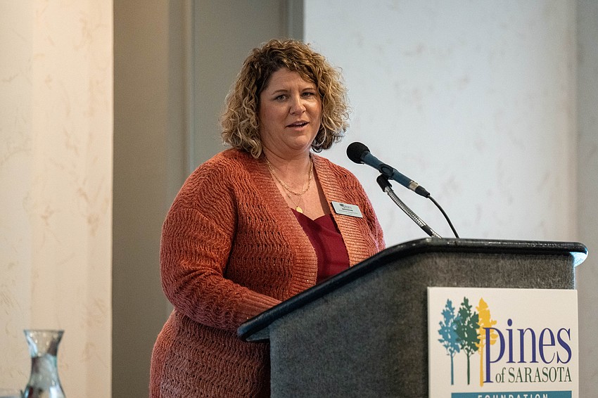 The Pines of Sarasota Foundation President Andrea Stephens speaks at the luncheon.