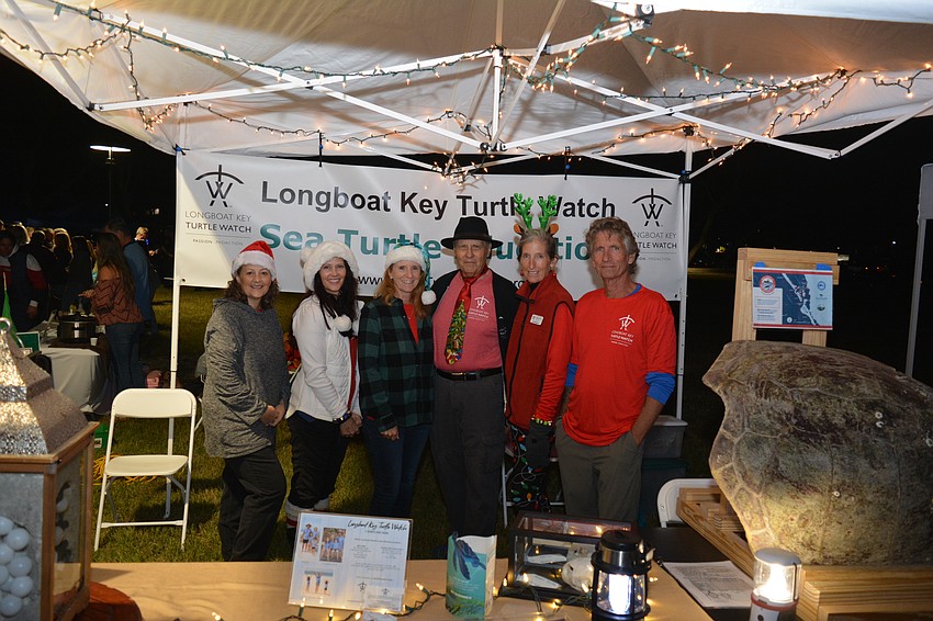 A group of volunteers with Longboat Key Turtle Watch set up at Light Up Longboat to educate residents who passed by.