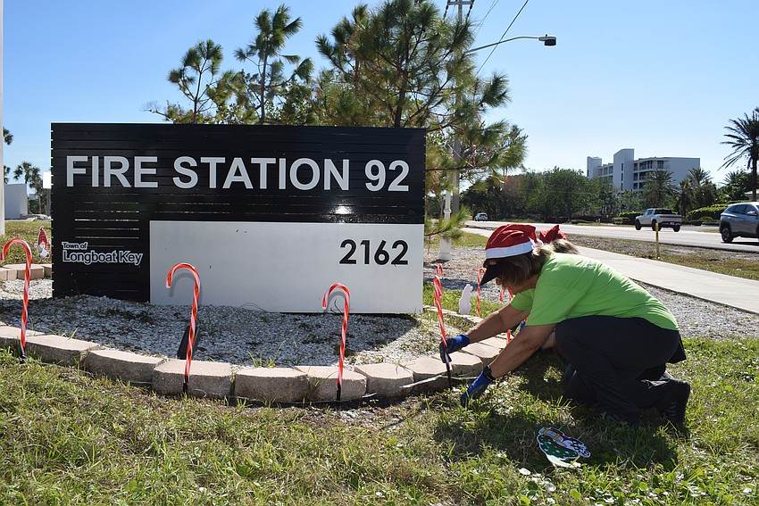 FPL Volunteer Rae Dowling decorating the Longboat Key Fire Rescue.
