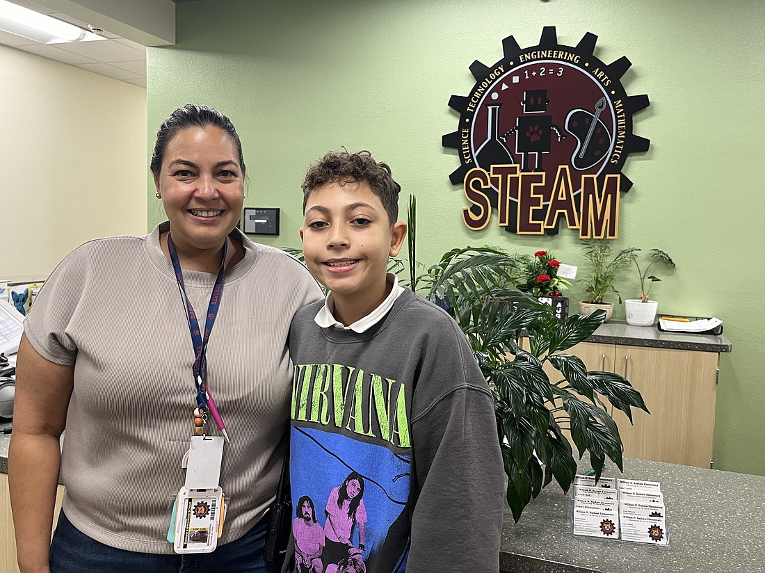 Michelle Sanchez, a paraprofessional at William H. Bashaw Elementary School, is able to spend more time with her son Tiago Sanchez now that she works at his school.