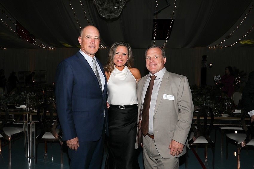 Kelly and Melissa Caldwell from the Caldwell Trust Co. with Boys & Girls Clubs of Sarasota and Manatee counties President and CEO Bill Sadlo.