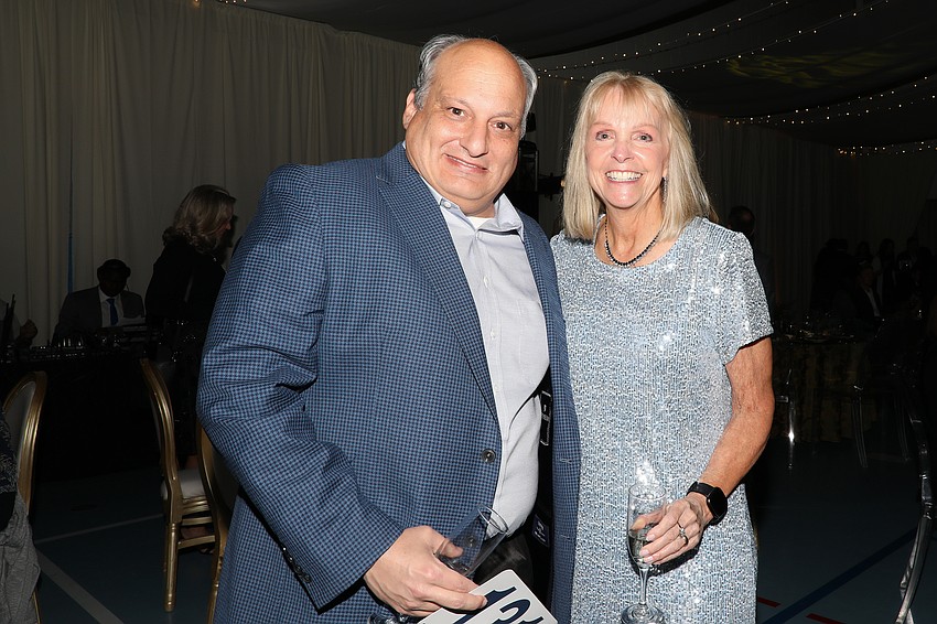 Jeff Troiano and Jan Miller share a quick moment before dinner.