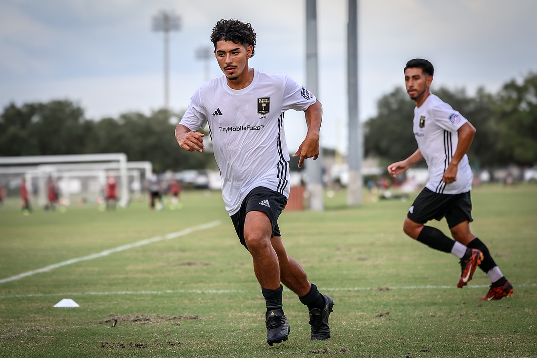 Florida Premier FC SWFL teammates Julian Paz (front) and Octavio Rodriguez run drills during practice.