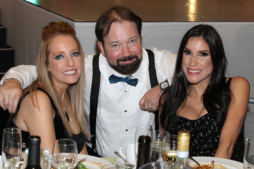 Jennifer Fiorica with 'soleman' Scott Middleton and his wife, Jessica.