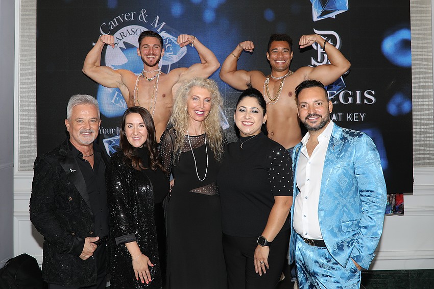 Janet Jankulovski and Ethan Kidd-Oyakhilome muscle up for a photo with Shawn Gross, Victoria Stanaitis, Kristin DeFrancisco, Melissa Putman and Nati Shabat.