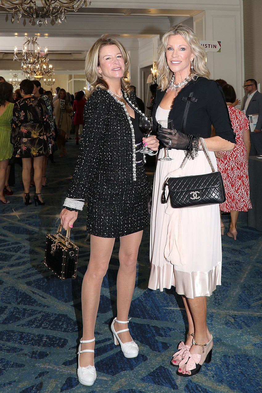 Elizabeth Moore and Dawn Spencer make a winter black comeback on a chilly Florida morning.