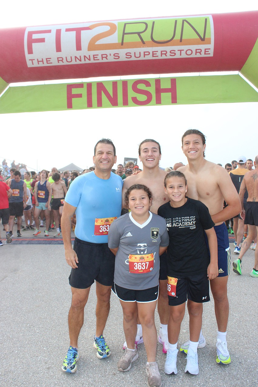 The Yanney family of Longboat Key ran the Turkey Trot together. They are Christopher, Vance and Chris Jr. (back); and Elsie and Xavier (front).