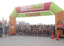 The runners all reach for their watches as the 2024 Florida Turkey Trot begins at Nathan Benderson Park.