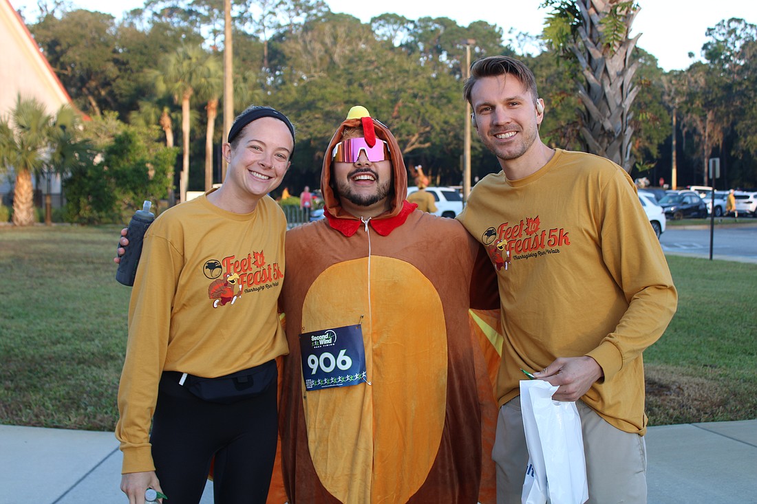 Kennedy Pursell and Garrett Wysocki with their turkey friend Ryan Ly. Photo by Alexis Miller