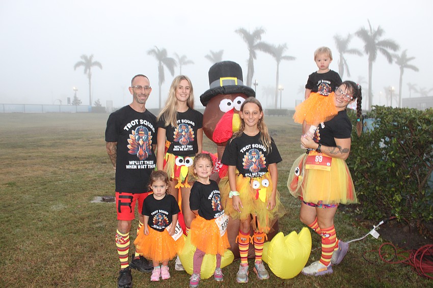 The Goncalves family of North Port ran together. They are, in the front, Amiya (3), Athena (5) and Aryanna (11), and in the back are Jeremy, Charlotte (16), a big turkey, Asheya (1) and Chey.