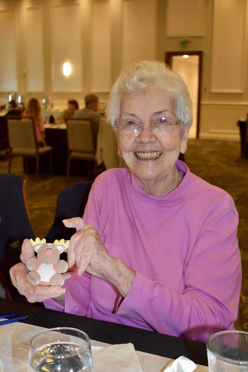 Bradenton's Lilyan Shoosmith paints a reindeer ornament.