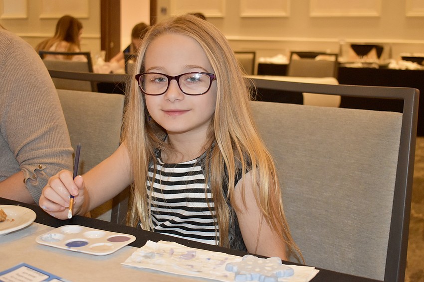 Bradenton's Emma Hamper, 6, is working on a snowflake.