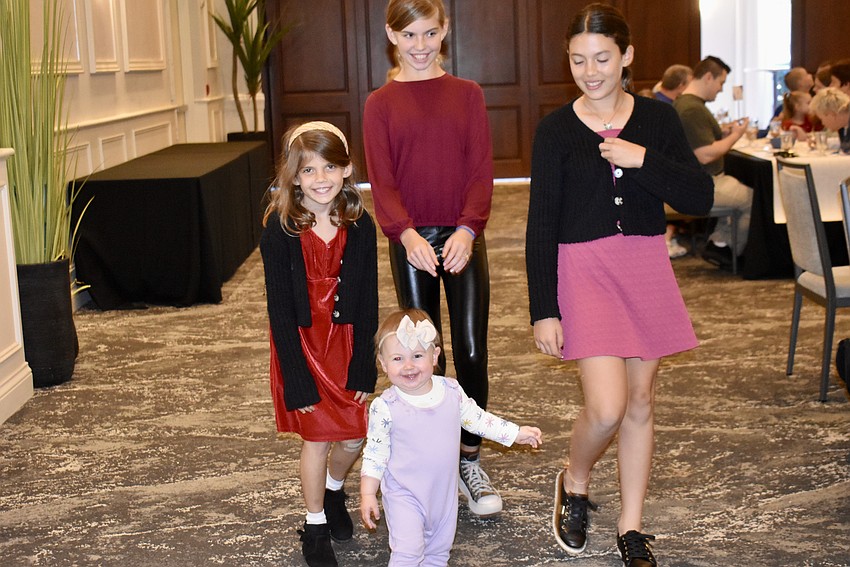 Leila Freeman, 1, is on the run. Veda Krolik, Autumn Bryan and Rhea Krolik chase after her.