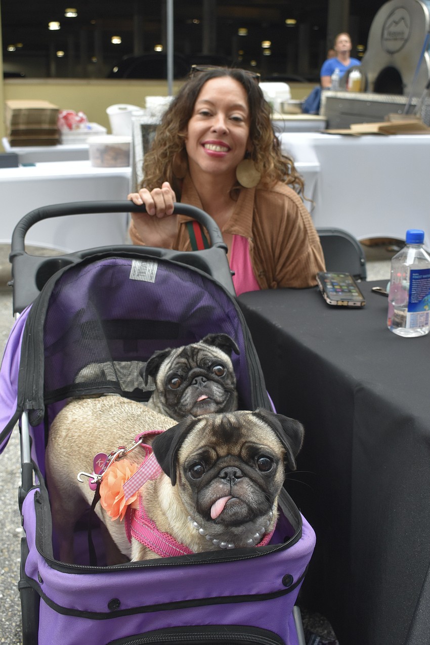 Janet Guzman brought along her pugs Kiwi and Kalua.