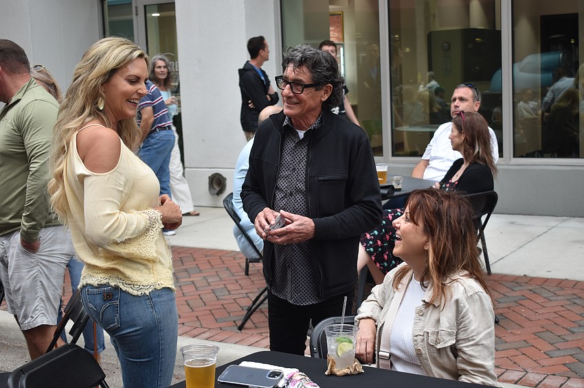 Stephanie Springstroh talks with Johnny and Michele Mouradian.