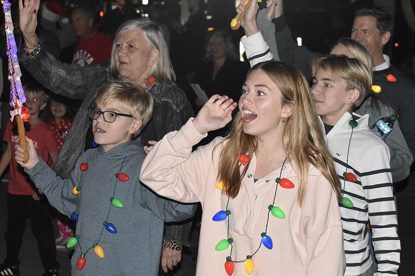 Nancy Gorsha, Cameron Mears, 11, Sophia Orzechwski, 14 and Brady Mears, 14, welcome Santa Claus.