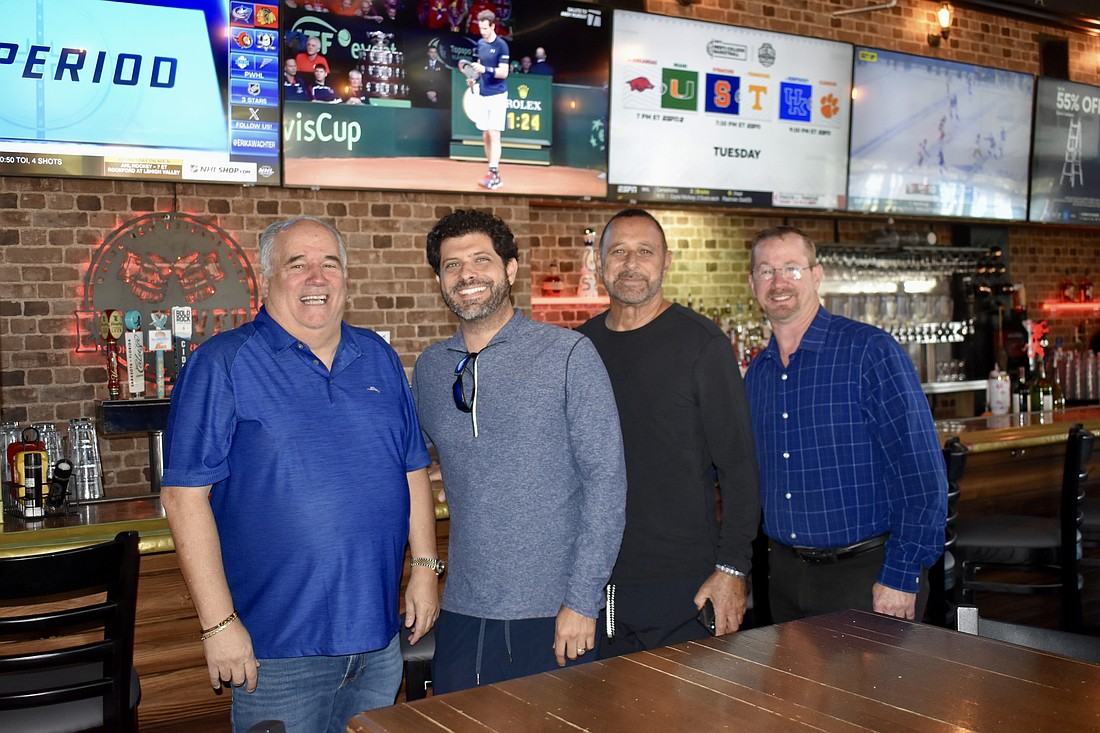 Bob Bender, Adam Myara, Albert Myara and Bruce Mahnke own Ed's Tavern and McGrath's Kitchen & Cocktails on Main Street.