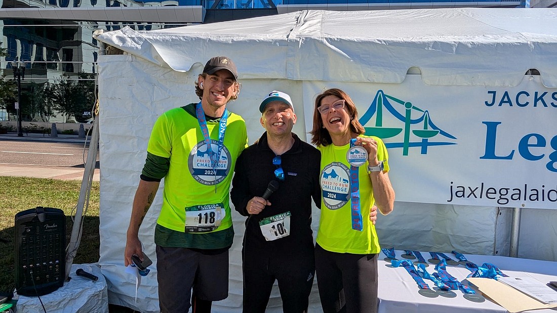 From left, Ryan Emilio, Freed to Run Challenge founder Mike Freed and  Regina Sooey. Emilio and Sooey were winners of the 24-hour Challenge.