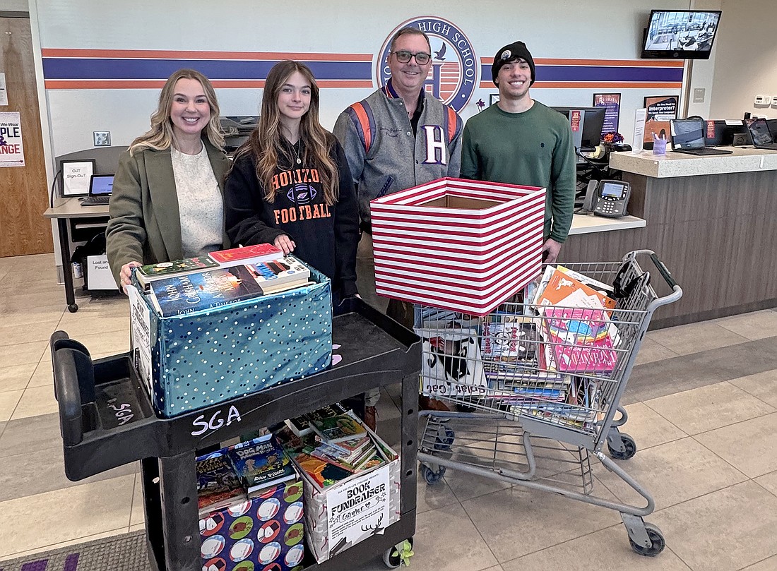 From left: Hi-Lite Coaching founder Jessica Villegas, SGA Marketing Director and senior Josalyn Wirbel, Principal Andrew Jackson and SGA Vice President of Student Life Brooks Kelley.