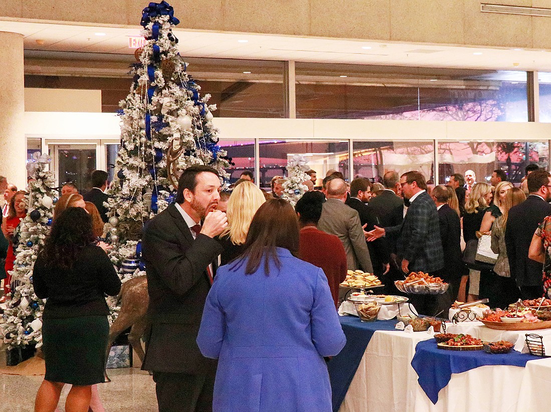 Partygoers enjoy the 2023 Jacksonville Bar Association Bench & Bar Holiday Party.