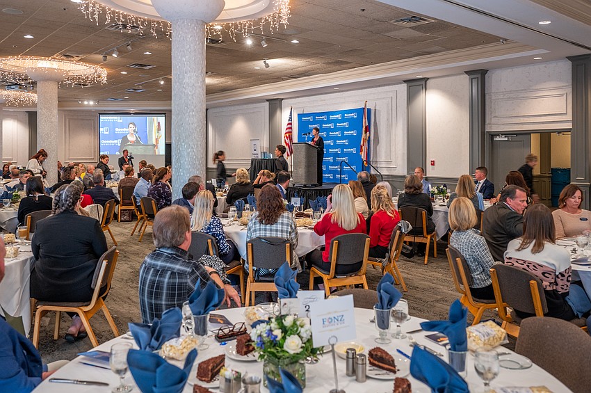 Margie Genter, VP of Mission Services, Goodwill Manasota addresses the audience before lunch.