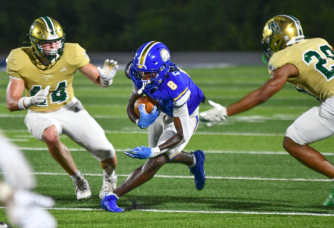 Royals' athlete Danny Odem III (No. 8) weaved through defenders against Rabun Gap.