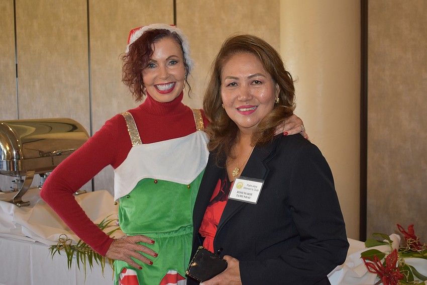 Katherine Pike and Rosemarie Tamunday attend the Palm Aire Women's Club luncheon at the Palm Aire Country Club Dec. 5.