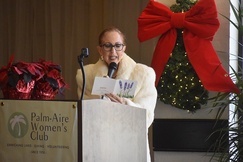 Treasurer Susan Romine reads thank you letters from grant recipients.