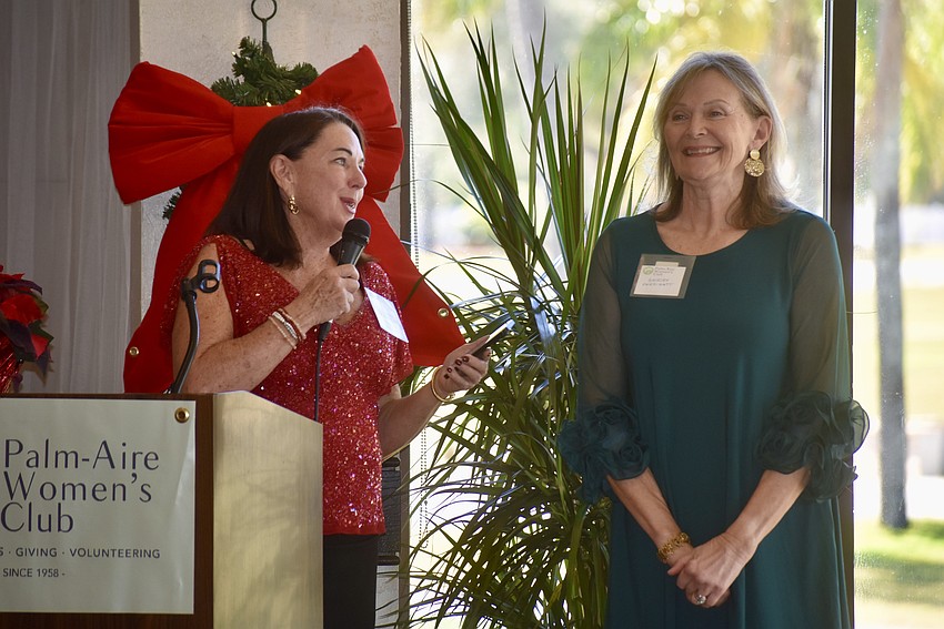 Pattie Meades introduces new member Shirley Perdisatt to the club. Since Perdisatt moved from Chicago, Meades asks the other members from Chicago to introduce themselves before the end of the luncheon.