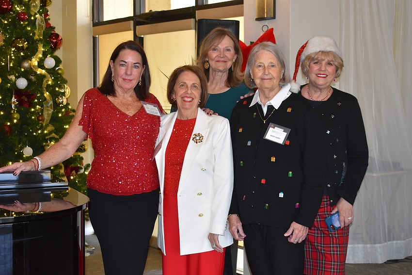 New and old members celebrate the holidays together at the club's December luncheon. From left to right: Membership chair Pattie Meades, new members Pat Reinhart, Shirley Perdisatt, Mary Gard and Co-president Debi Frock.