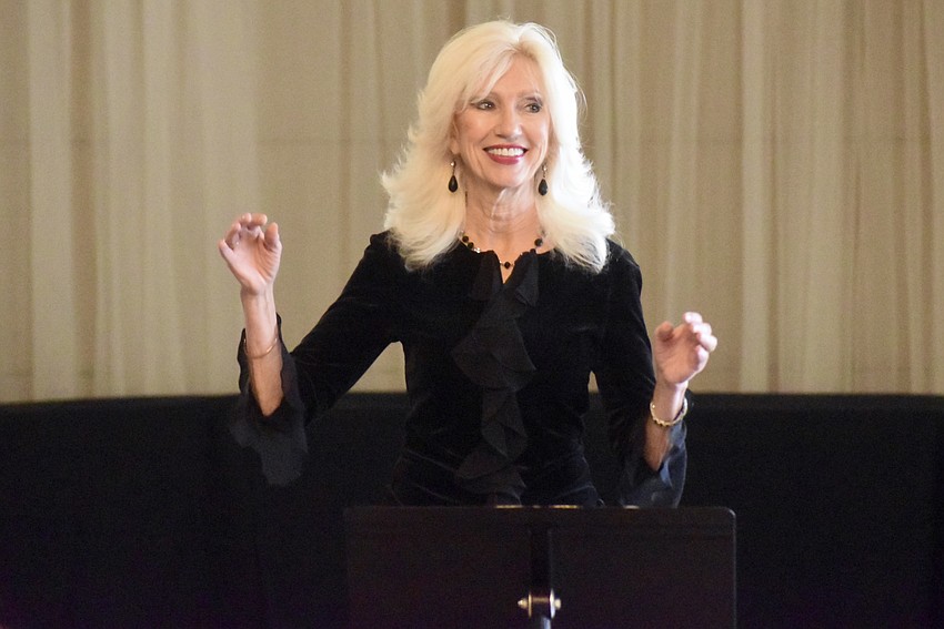 Melody Dickerson leads the chamber choir. She's been with the college for 21 years.