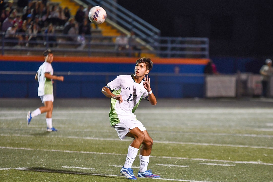 Windermere junior Andres Grisanti (No. 17) lined up a header in the Wolverines’ 8-2 win over West Orange.