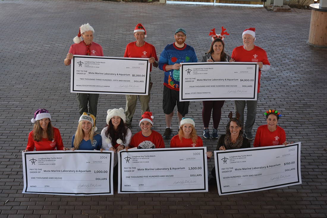 Members of Longboat Key Turtle Watch met Mote Marine Laboratory & Aquarium staff to present this year's donations to the facility.