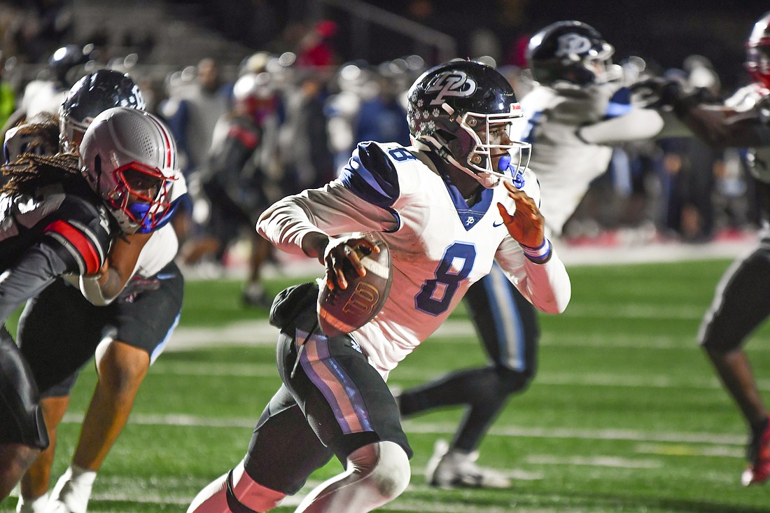 Dr. Phillips star quarterback Stanley Anderson-Lofton scrambled out of the pocket against Lake Mary.