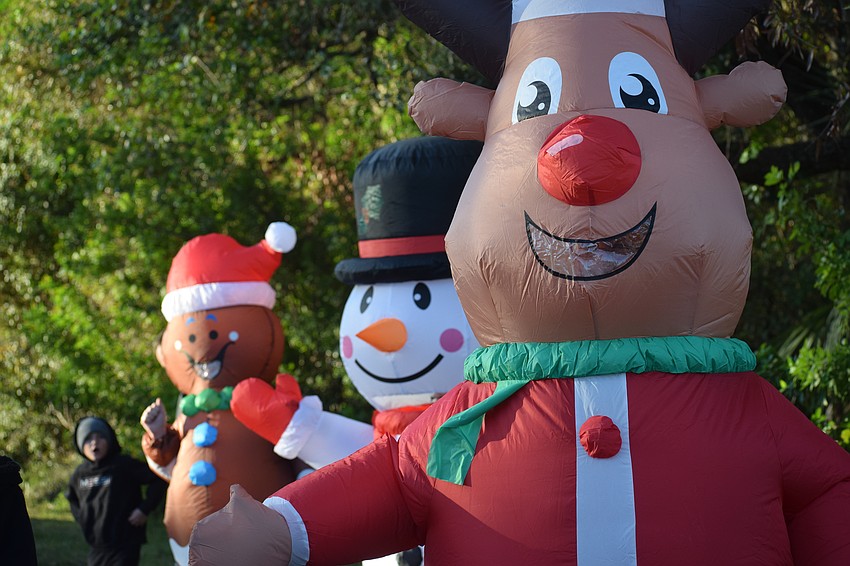 A reindeer, snowman and gingerbread man cheered on runners at the Jingle Jog 5k at The Haven of Sarasota on Saturday morning.