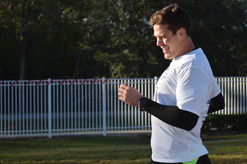 Jonathan Zagroba of Bradenton completes his overall victory in 18:18.20 at the Jingle Jog 5K hosted by The Haven of Sarasota on Saturday.