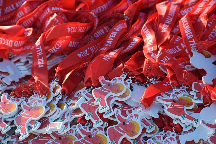 Medals were handed out to all participants of the Jingle Jog 5K on Saturday morning at The Haven in Sarasota.