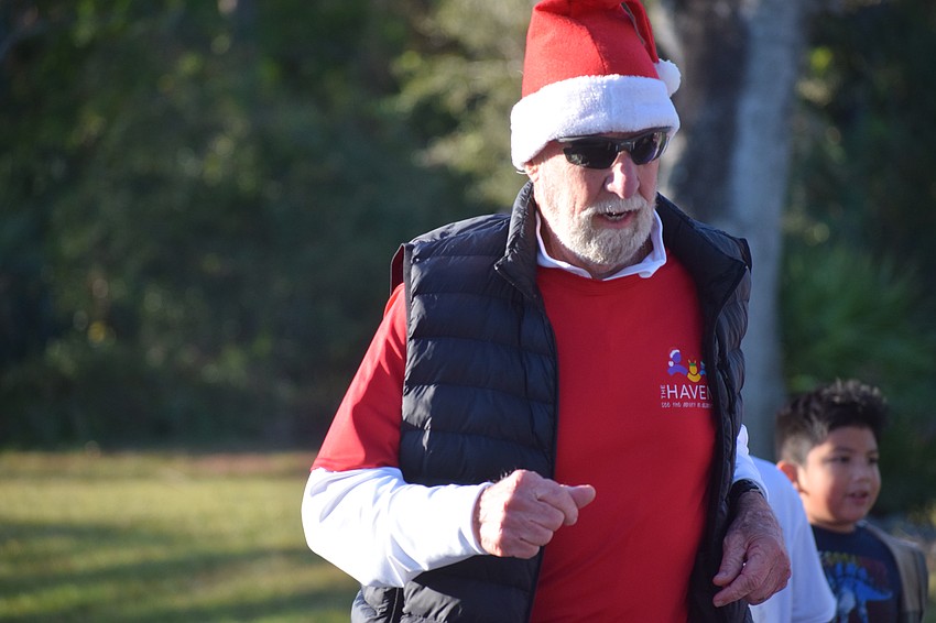 Jerry Downs ran his 5K with a Santa hat on during a brisk Saturday morning at The Haven of Sarasota.