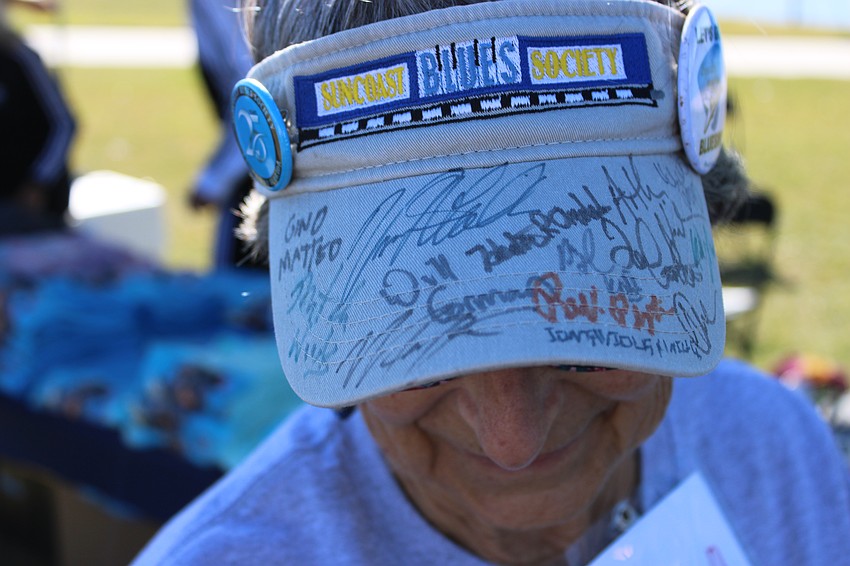 South Pasadena's Linda Laplante shows off the autographs she collects as she travels the country to see top blues artists.