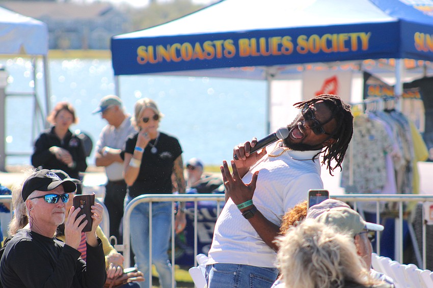 Fans have the opportunity to take up-close photos when blues artist Dylan Triplett ventures into the crowd during the Lakewood Ranch Blues Festival.