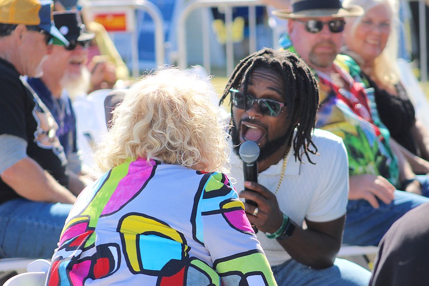 Blues artist Dylan Triplett gets up close and personal with the fans during the Lakewood Ranch Blues Festival.