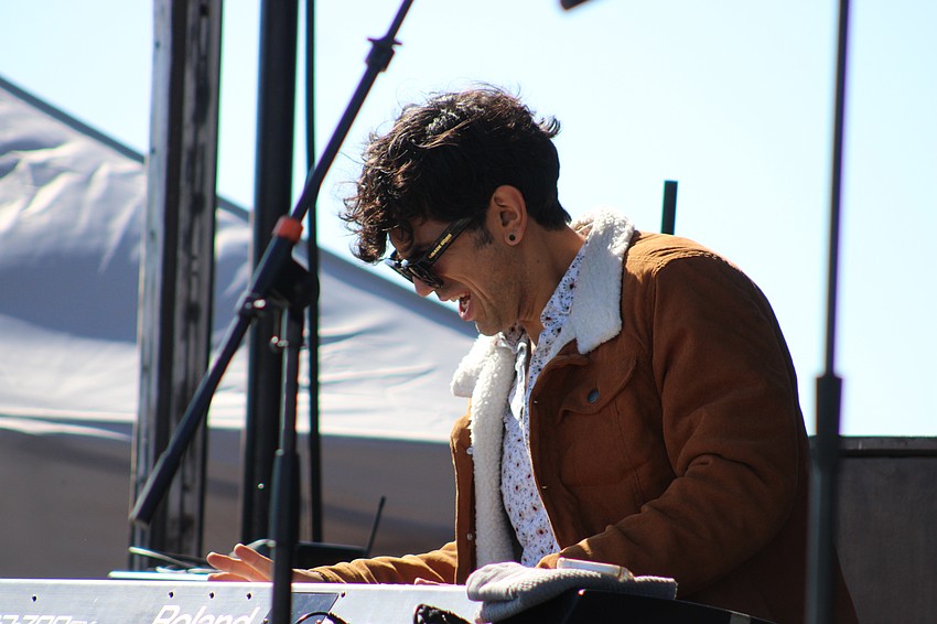 Ryan Marquez launches into a solo on the keyboards as he performs with Dylan Triplett.