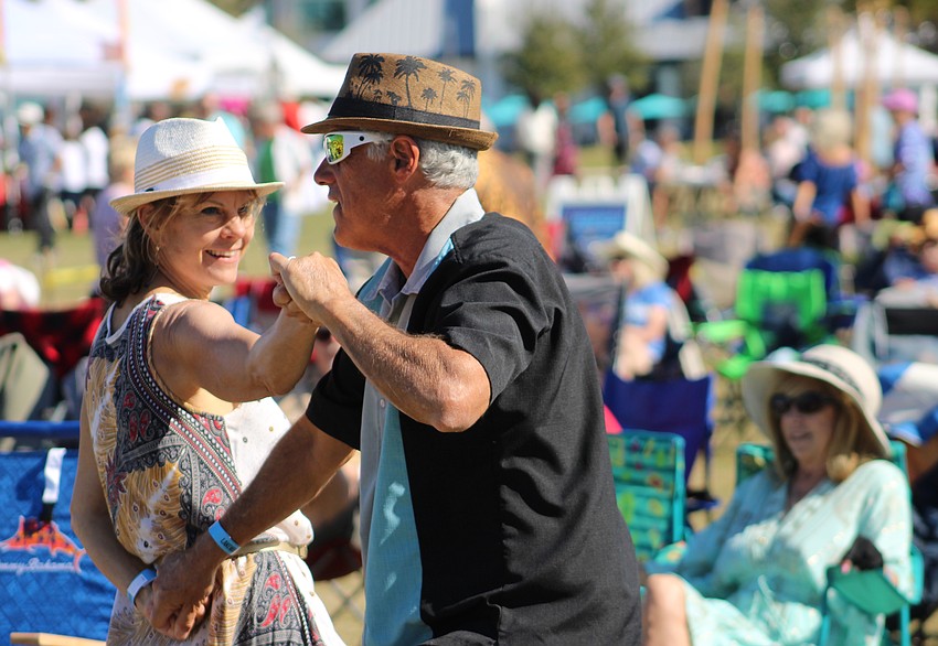 Naples' Kaata Mrachek and Bradenton's Laurence Lederer dance to the beat during the inaugural Lakewood Ranch Blues Festival Dec. 7 at Waterside Place.