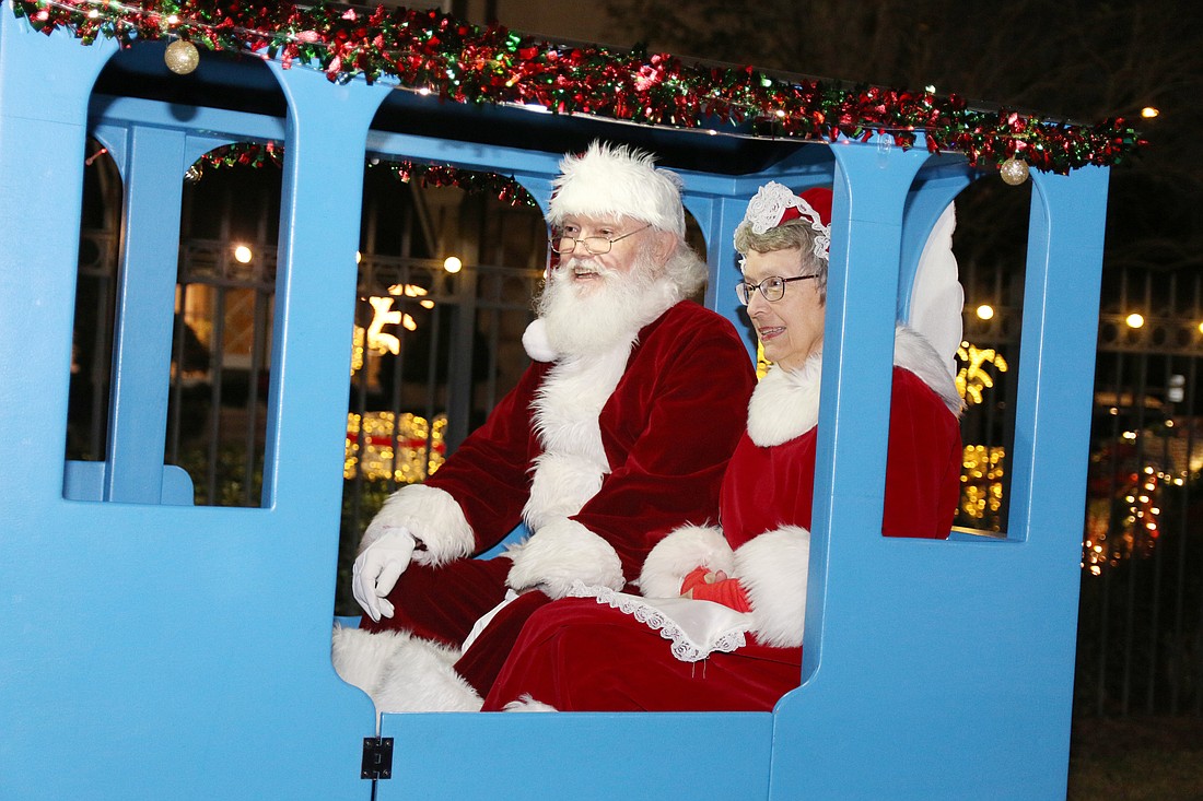 Santa and Mrs. Claus arrive on a train during the 46th annual Christmas Gala at The Casements on Friday, Dec. 6. Photo by Jarleene Almenas