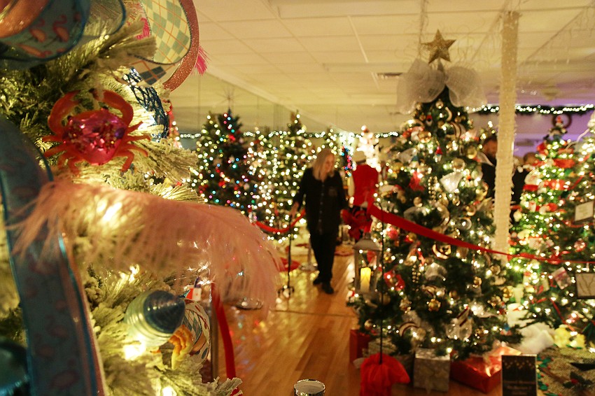 Bambi Pro looks at Christmas trees during the 46th annual Christmas Gala at The Casements on Friday, Dec. 6. Photo by Jarleene Almenas